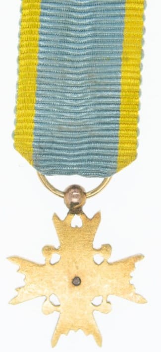 4th class order of the Sacred  Treasure miniature in gold.jpg
