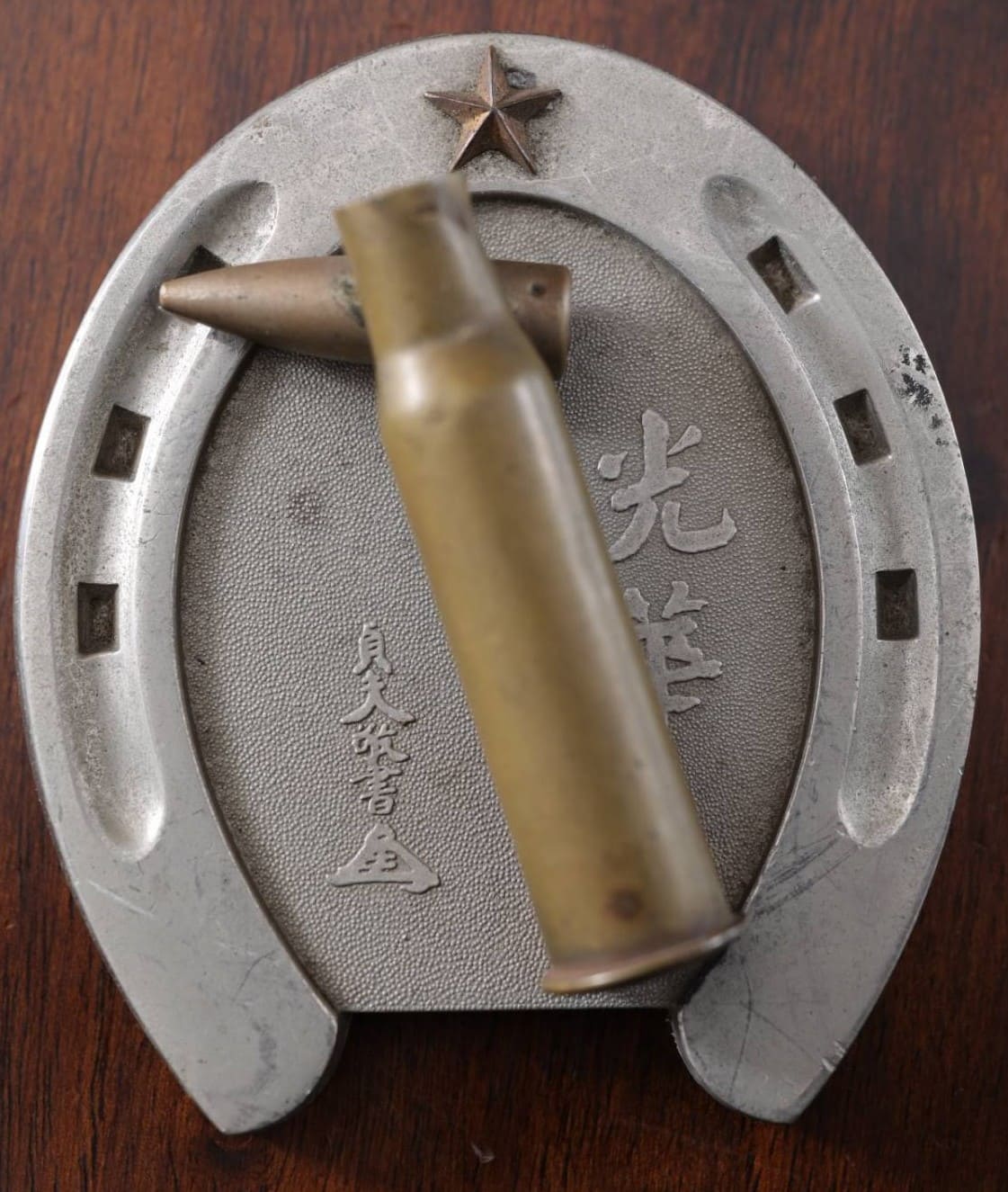 Bullet Case on a Horseshoe Commemorative Paperweight.jpg