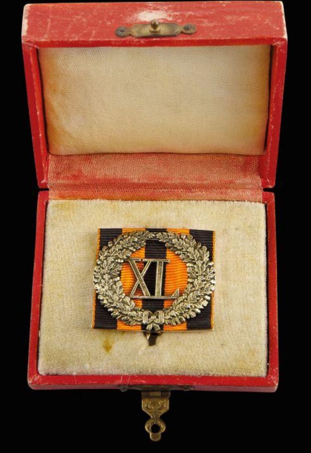 Cased badge for 40 years of service  on St.George ribbon.jpg