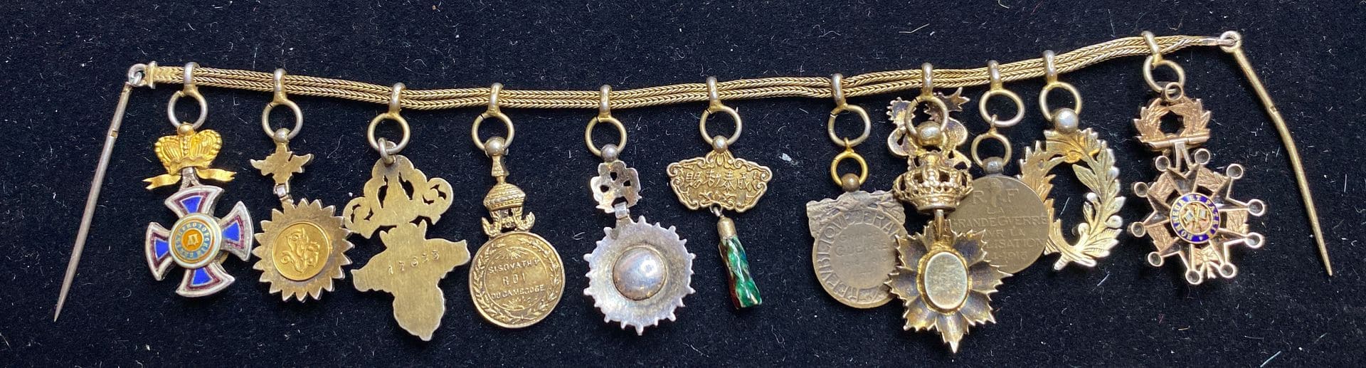 Chain of eleven miniatures made by Arthus Bertrand, Paris.jpg