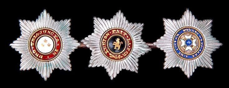 gold brooche  mounted with miniature breast stars  of the Russian Orders.jpg