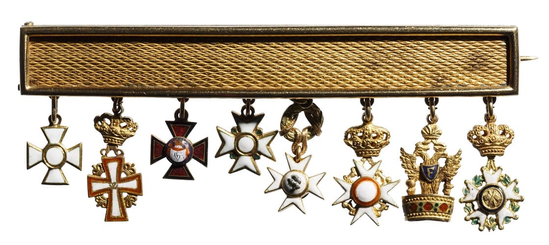 Gold display with eight miniature orders.jpg