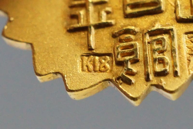 Golden  Watch Fob of Kazoku Kaikan.jpg