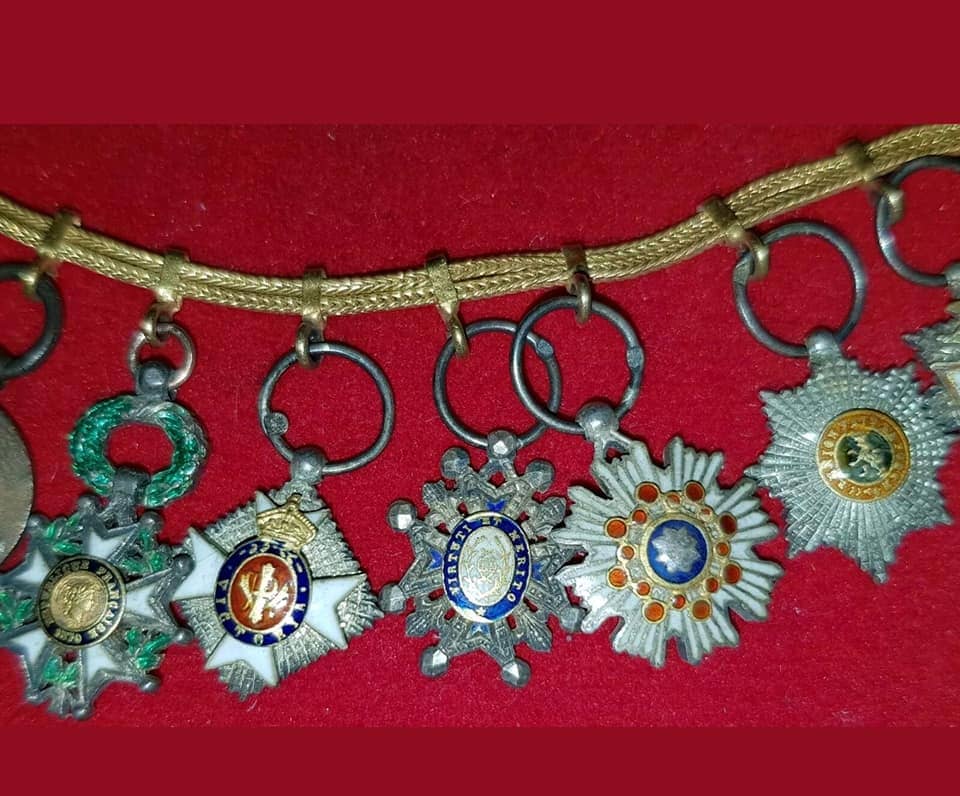 Group of miniature awards with Sacred  Treasure order breast star and Double Dragon.jpg