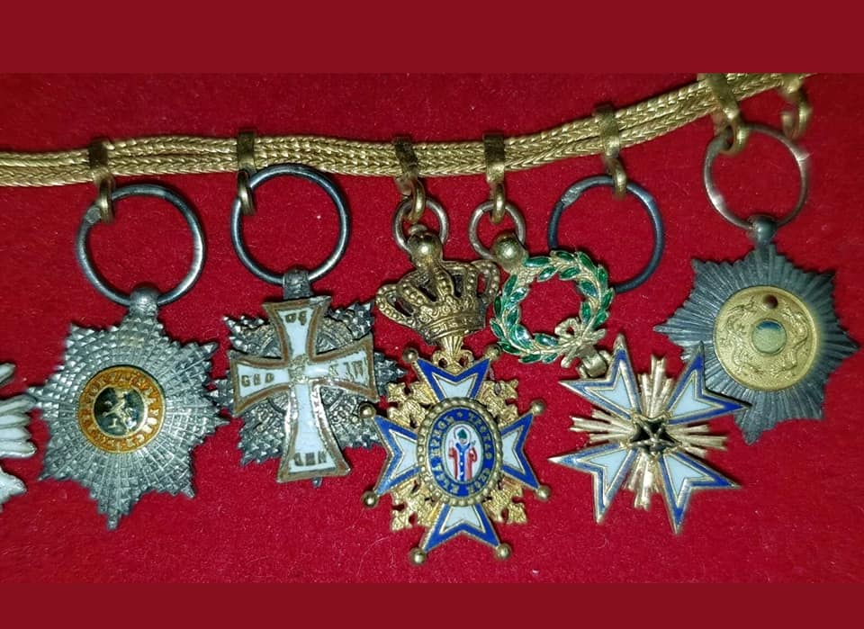 Group of miniature awards  with Sacred Treasure order breast star and Double Dragon.jpg