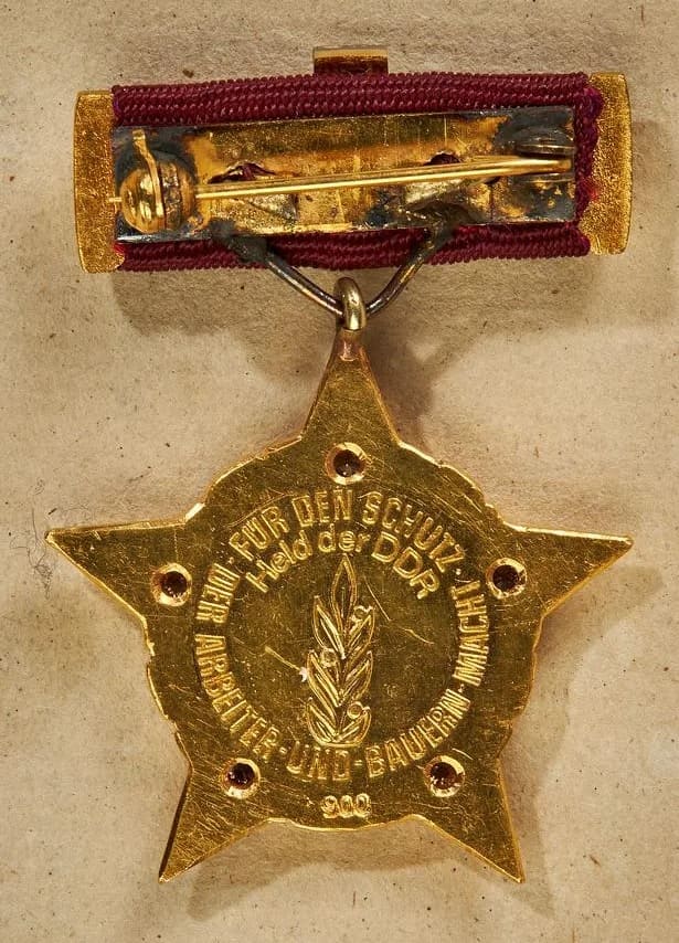 Honecker's Hero  of the DDR golden star.jpg