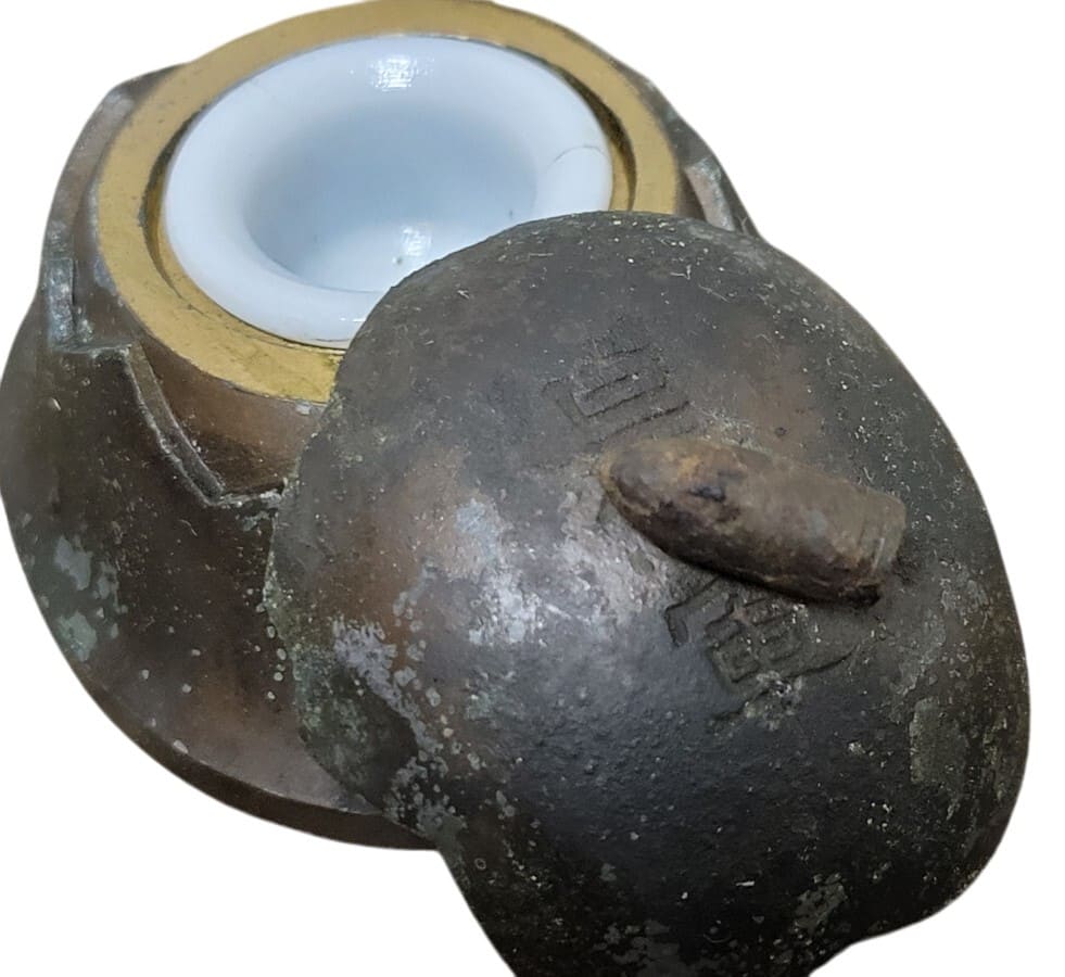 Japanese Army Helmet Shaped Inkwell.jpg