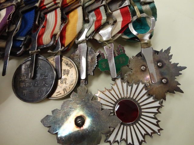 Japanese Medal Bar with Manchukuo Awards  ..jpg