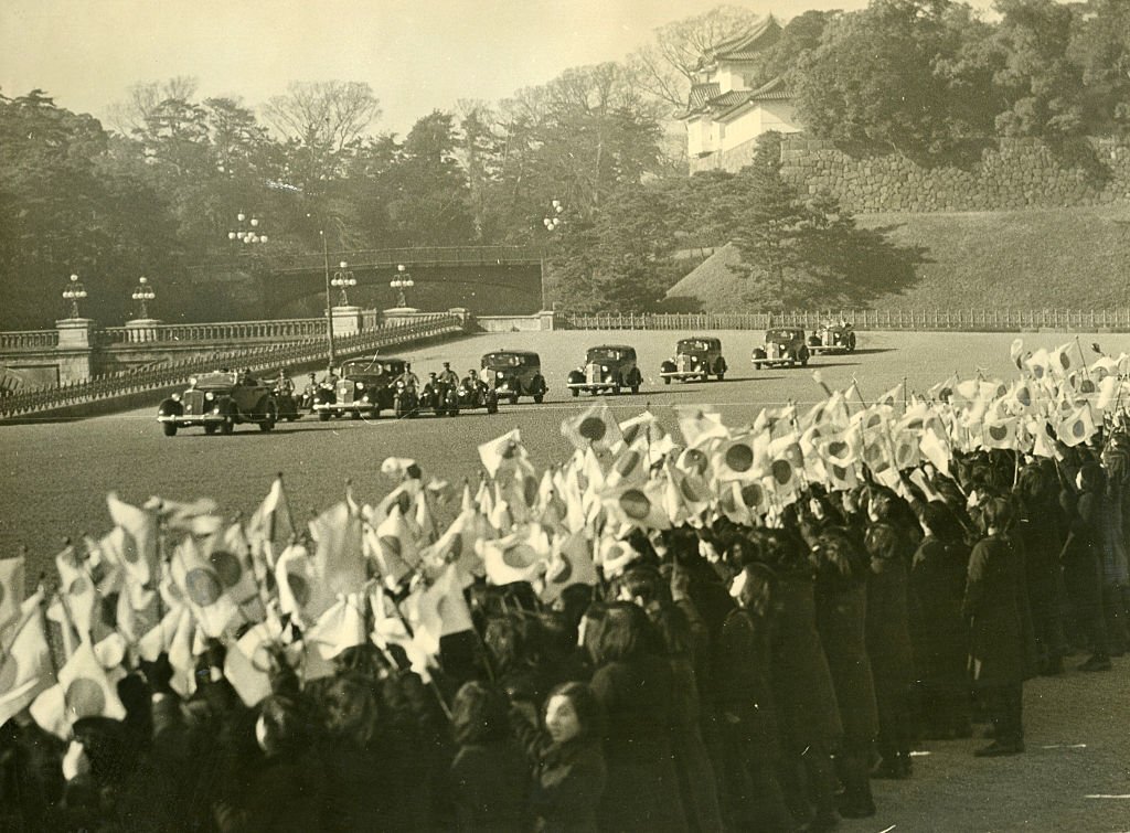 Japanese people wave flags.jpg
