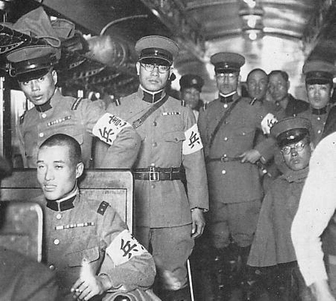 Kenpeitai officers aboard a train in 1935.jpg