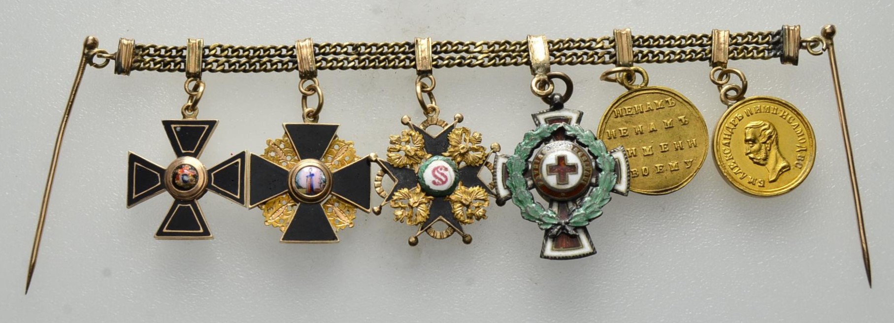 Miniature chain with six miniatures of awards.jpg