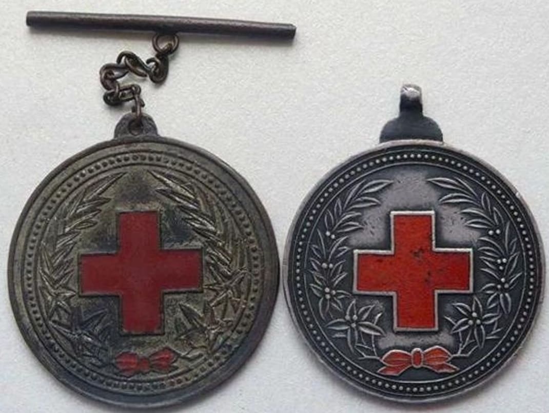 Non-silver variant of medal.jpg