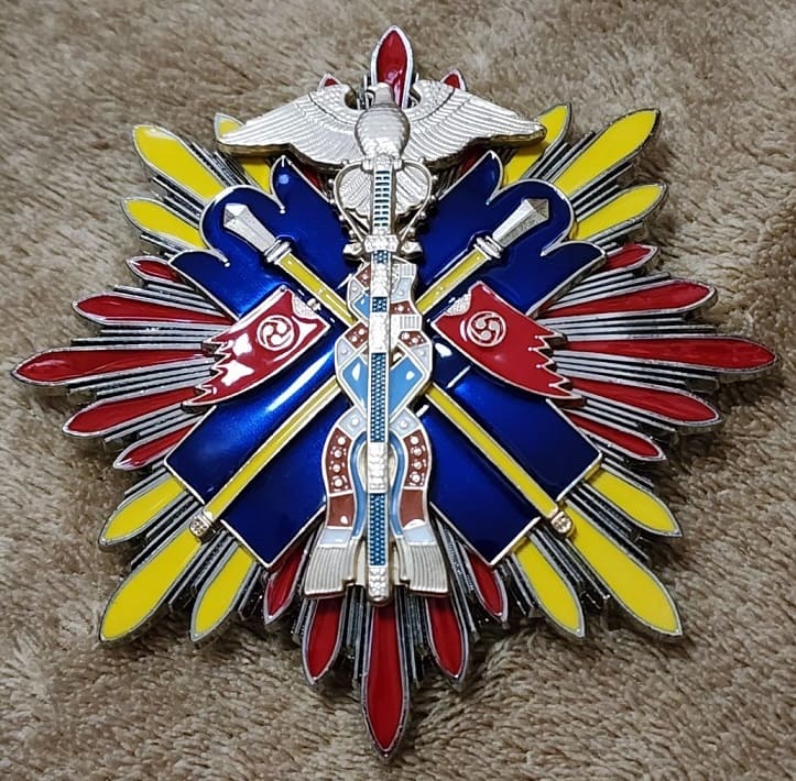 Order of the Golden Kite Fake breast star.jpg