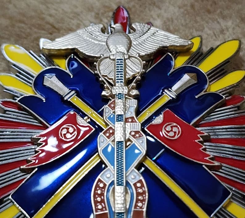 Order of  the Golden Kite Fake breast star.jpg
