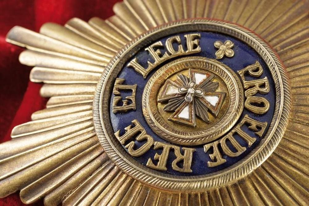 Order of  the White Eagle fake breast star.jpg