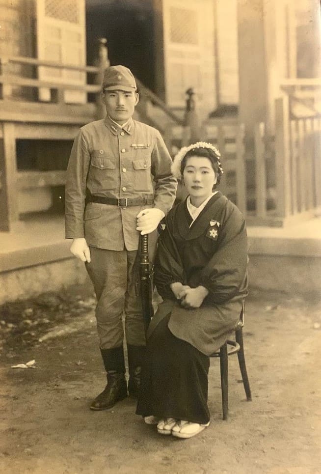 Photo with National Ceremonial Bows.jpg
